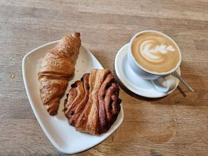 Vegan chocolate croissant and vegan chocolate swirl + oatmylk latte at Ecocafe in Budapest