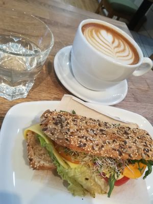 Vegan cheese sandwich, plant-milk latte and lemon water at Ecocafe in Budapest