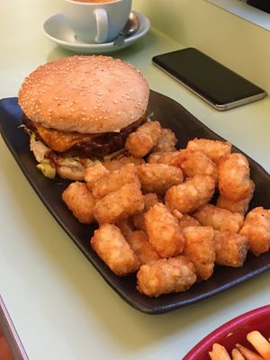 Baron burger with tater tots  at Two-Bit Villains in Adelaide