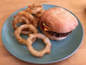 vegan cheeseburger with onion rings  at Two-Bit Villains in Adelaide
