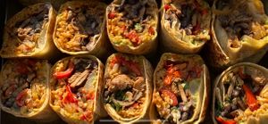 Vegan burritos, cut I half for a catering.  at FARMacy Cafe in Charlottesville