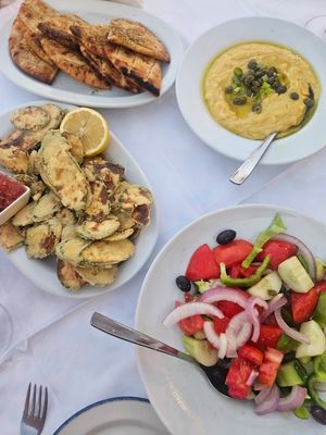 Greek salad (without feta), zucchini fritters, fava dip, pita at Amphora Restaurant in Crete