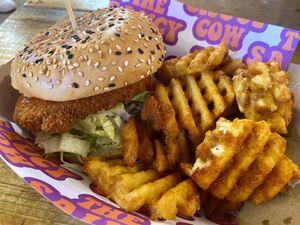 Vegan Buffalo chicken burger with waffle fries  at The Saucy Cow in Cork