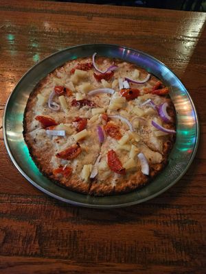 Vegan cauliflower crust with vegan cheese, tomato, red onion, and pineapple with herb-infused olive oil at Bru Daddy's Brewing Co in Allentown