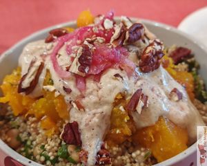 butternut roti, quinoa, chickpeas, parsley, pickles, pecan, zaatar sauce at Café Studio in Paris