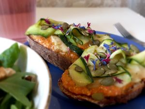 Ktipiti toast | bell pepper and feta cream, marinated zucchini and pumkin seeds at Café Studio in Paris