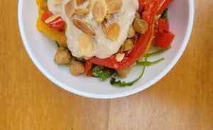 Roasted bell pepper and chick peas, couscous, yogurt and zaatar sauce, almonds at Café Studio in Paris