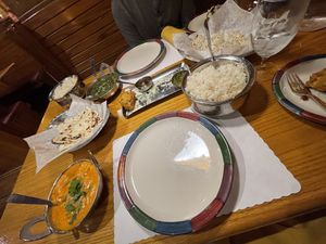 Tofu coconut kurma, tofu saag with coconut cream, garlic naan, peshawari naan at Mumbai House in Salt Lake City