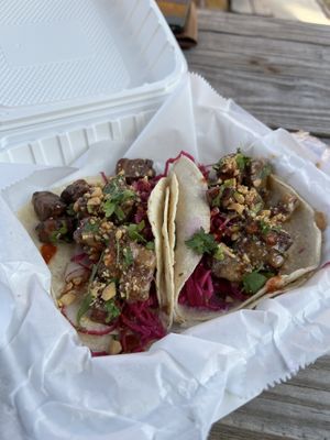 Tempeh Satay Tacos - lemongrass tempeh, thai inspired peanut sauce, pickled red cabbage, fresh radish + cilantro, crushed peanut, sriracha, on corn tortillas  at Mean Mandy's in Asheville