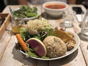 Salad with “honey”mustard dressing, brown rice, bean dip with nachos, karaage and tomato side dish  at AIN SOPH.Journey in Tokyo
