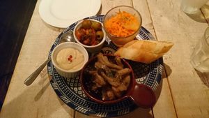 Hummus, mushrooms, olives, carrots and bread at AIN SOPH.Journey in Tokyo