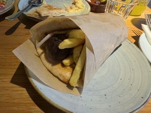 Vegan meatball flatbread wrap  at The Real Greek in Edinburgh