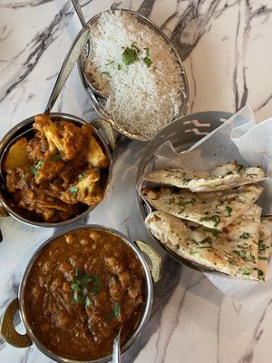 Chana masala, aloo gobi, garlic naan   at Aromas Of India in Williston