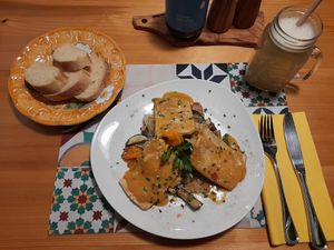 Tofu in homemade Satay sauce on baked vegetable. at Old Lemon Tree in Klagenfurt