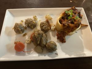 Seitan, vegetables and olives in puff pastry with mushroom and potato gnocchi    at Bar Recyclart in Brussels