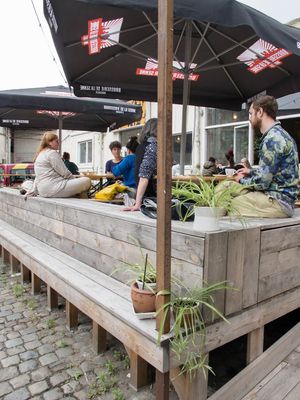 Sunny outside terrace in the big courtyard at Bar Recyclart in Brussels
