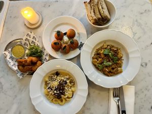 From left to right: croquettes, dauphine potatoes, orecchiette, roasted cauliflower    at Faubourg Daimant in Paris
