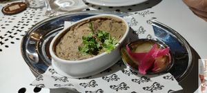 Puy lentil rillettes

FLESH AND FILAMENTS OF LENTILS STORED IN FAT, RED ONION PICKLES AND PICKLES at Faubourg Daimant in Paris