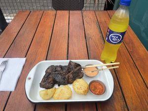 Medium portion of anticuchos with Inca kola   at Oiga in Lima