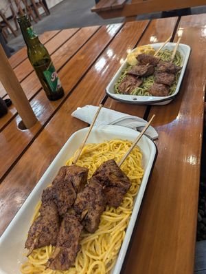 Anticucho con tallarines a la huancaína, y tallarines verdes at Oiga in Lima