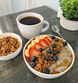 The Chia Bowl - chia pudding, granola, banana, berries and slice of pecan butter toast. at Vibrant Beat Cafe in Fort Myers