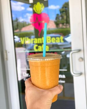 The Mandarin Morning Smoothie - a refreshing and energizing smoothie made with mandarin oranges, carrot, ginger, pineapple and coconut water. at Vibrant Beat Cafe in Fort Myers
