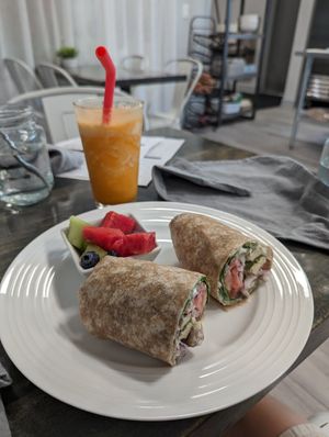 Gyro wrap, one of the smoothies in the background. at Vibrant Beat Cafe in Fort Myers