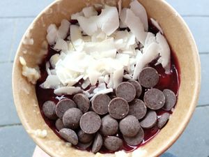 porridge, berry sauce, coconut, dark chocolate at Haferkater - Hbf Münster in Muenster