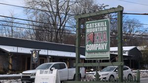 Exterior sign at Catskill Mountain Pizza Co in Woodstock