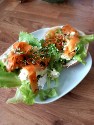 Bagel topped with smoked carrot on tofu egg mayo and salad  
Vegan at Soul Foods in Alford