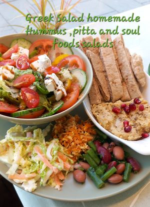 Bowl of  sliced tomatoes,cucumber,red onion ,olives  peppers,herbs  feta dressed with olive oil/balsamic glaze. homemade hummus dip and soulfoods salads. Vegan/dairy feta available at Soul Foods in Alford