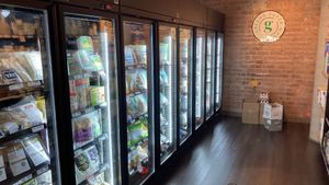 Frozen fridge section  at Greens Supermarket in Newtown