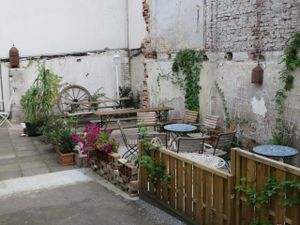 backyard for sitting outside in the summer, sheltered  by a wall at L'arabesque in Bielefeld