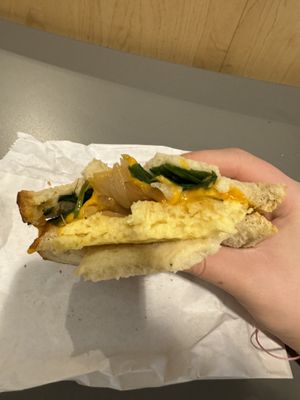 inside (Just Egg, cheese, onions, spinach)   at SEA - Costa Coffee - North Terminal in Seattle
