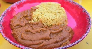 Nkatsi Froyi & Saffron Rice: "Creamy natural peanut butter cooked slowly with onions, ginger, garlic, tomatoes, and a blend of spices, creating a rich stew" at Asempe Kitchen in Ithaca