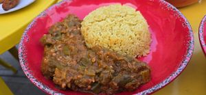 Emomi & Saffron Rice: "Dive into this luscious stew where okra meets a medley of onions, ginger, garlic, and tomatoes, all simmered together" at Asempe Kitchen in Ithaca