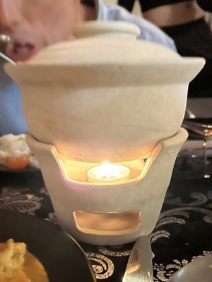 They serve all the curries in these pots which keeps everything nice and hot x  at Finale'  in Derby