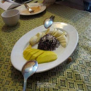 dessert. mango, banana, brown sticky rice, covered with coconut milk. at May Kaidee's Vegetarian Restaurant - Samsen in Bangkok