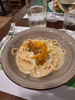 Spaghetti cacio e pepe, fiori di zucca croccanti e lime at La Puntarella Pazza in Rome