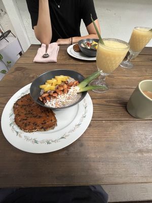Guava jam / avocado oil toast; mango / soursop smoothie ; coconut chia pudding / star fruit, toast coconut and almonds, pineapple   at La Botanica Hotel in San Juan