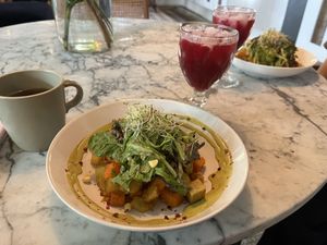 Melon / beet juice ; green salad with cashew tahini dressing, roasted potatoes / taro   at La Botanica Hotel in San Juan