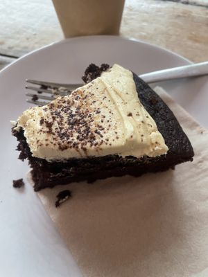 Excellent vegan cake with oat milk latte   at The Secret Garden Cafe in Cardiff