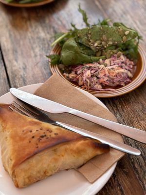 Vegan samosa and a side salad   at The Secret Garden Cafe in Cardiff