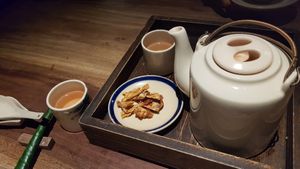 Lotus tea served with dried & spicy pineapples at Hum Vegetarian - District 3 in Ho Chi Minh City