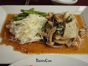 Mushroom Salad with Cabbage, sprinkled with crunchy ground roasted rice and spicy sauce. at Hum Vegetarian - District 3 in Ho Chi Minh City