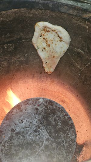 Naan cooking in Tandoori at Zeera By The Bay in Pickering