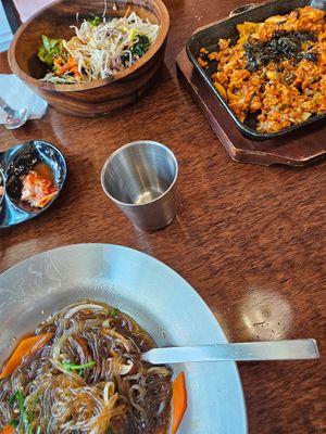 Japchae (in the front), Kimchi rice (on the right), Bibimbap (background) at Vegan Kitchen - 비건 키친 in Seoul