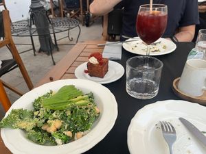 Kale caesar salad. Bravas cube in the background at L'Espai in Tossa De Mar