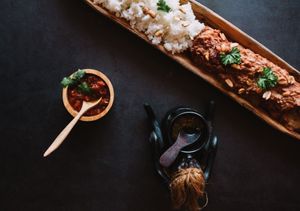 Mafe tofu is a traditional African dish that consists of a peanut sauce served with rice and with a tomato and a spicy sauce. at Yuni Yupoun  in Luang Prabang