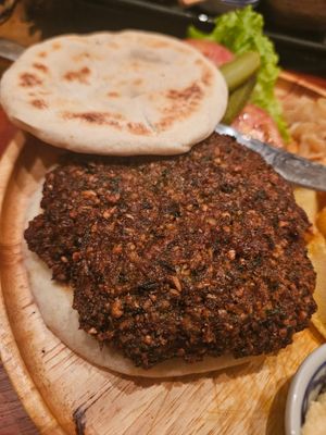Chickpea burger (the staff advised the bread used milk and suggested a pita instead - very reassuring) at Yuni Yupoun  in Luang Prabang